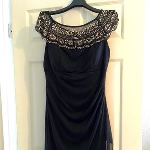 Black evening dress with gold beaded collar